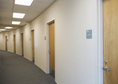 View of an empty corridor with closed doors